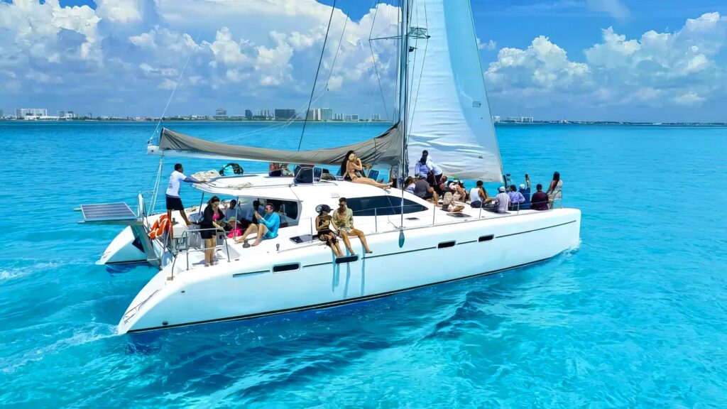 People enjoying on catamarans in cancun